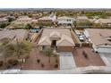 An aerial view of a single-story home showing the roof, backyard, and surrounding neighborhood at 22065 W Twilight Trl, Buckeye, AZ 85326