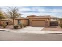 Inviting single-story home with desert landscaping and a spacious driveway leading to a two-car garage at 22065 W Twilight Trl, Buckeye, AZ 85326