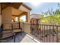 Private balcony with seating, offering views of the surrounding neighborhood at 2821 S Skyline Dr # 107, Mesa, AZ 85212