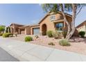 Charming home with well maintained landscaping and inviting curb appeal on a sunny day at 3816 E Rakestraw Ln, Gilbert, AZ 85298