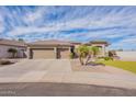 This well-maintained single-story property features a three-car garage and drought tolerant landscaping at 3948 E Vallejo Dr, Gilbert, AZ 85298