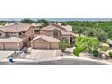 Beautiful home with a tile roof, desert landscaping, and a spacious three-car garage at 4235 W Harrison St, Chandler, AZ 85226