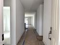 Inviting hallway with wood flooring and access to various rooms in the house at 5628 W Summerside Rd, Laveen, AZ 85339