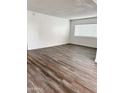 Spacious living room with new floors, white walls and trim, and bright natural light at 5987 N 48Th Dr, Glendale, AZ 85301