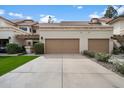 Spacious two-car garage with a long driveway and well-maintained landscaping at 9705 E Mountain View Rd # 1143, Scottsdale, AZ 85258