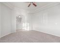 Spacious carpeted bedroom with ceiling fan and bright natural light at 13007 W Tuckey Ct, Glendale, AZ 85307