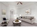 Bright living room boasts recessed lighting, neutral colors, and stylish furnishings at 13007 W Tuckey Ct, Glendale, AZ 85307