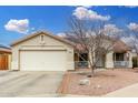 Charming single-story home featuring a two-car garage and desert landscaping for low maintenance at 13308 W Acapulco Ln, Surprise, AZ 85379