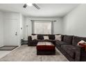 Inviting living room featuring a comfortable sectional sofa and bright natural light at 2112 E Minton Dr, Tempe, AZ 85282