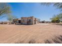 Spacious home with neutral stucco and a sprawling driveway at 2349 W Skyline Ln, San Tan Valley, AZ 85144