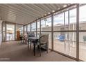 Enclosed sunroom featuring a table and chairs with views of the yard at 2650 W Union Hills Dr # 329, Phoenix, AZ 85027