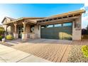 Charming single Gathering home featuring a covered porch, two car garage, and well maintained driveway at 3110 E Cat Balue Dr, Phoenix, AZ 85050