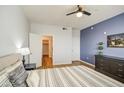 Comfortable bedroom with plush bedding, accent wall, and ample natural light at 3302 N 7Th St # 364, Phoenix, AZ 85014