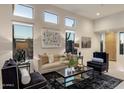 Bright and airy living room with stylish decor, contemporary furnishings, and large windows at 34423 N 68Th Way, Scottsdale, AZ 85266