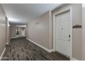 Well-lit hallway with carpet flooring and neutral walls leading to unit 4408 at 5350 E Deer Valley Dr # 4408, Phoenix, AZ 85054