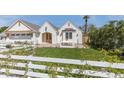 Beautiful white brick home featuring a cozy patio area and manicured green lawn at 542 E Hayward Ave, Phoenix, AZ 85020