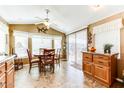 Bright dining area featuring neutral walls, tile floors, and natural light from large windows and doors at 17200 W Bell Rd # 866, Surprise, AZ 85374