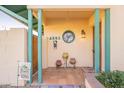 A welcoming front porch with a decorative stained glass window above the home's address at 1721 W Weldon Ave, Phoenix, AZ 85015