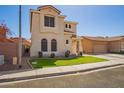 Charming home with a well-kept lawn, complemented by a two-car garage and inviting front entrance at 2635 E Chester Dr, Chandler, AZ 85286