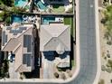 Aerial view of a well-maintained two-story home highlighting the tile roof and desert landscaping at 2811 W Glenhaven Dr, Phoenix, AZ 85045