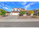 Charming two-story home with a two car garage, desert landscaping, and solar panels on the roof at 3614 W Alyssa Ln, Phoenix, AZ 85083