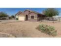 Single-story home with desert landscaping, a two-car garage, and fenced yard space at 3720 E Vista Grande --, San Tan Valley, AZ 85140