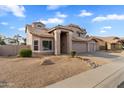 Attractive two-story home boasting desert landscaping, a tile roof, and an inviting entrance at 4607 E Rancho Laredo Dr, Cave Creek, AZ 85331