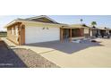 Attractive single-story home with a spacious driveway and low-maintenance desert landscaping at 518 S Racine --, Mesa, AZ 85206