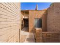 Exterior view showcasing a walkway to the front entry with courtyard and privacy at 5513 N 5Th Dr, Phoenix, AZ 85013