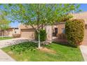 Inviting single-story home with a two-car garage, gated courtyard, and lush green lawn at 5513 N 5Th Dr, Phoenix, AZ 85013