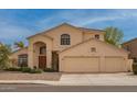 Inviting two-story home featuring a three-car garage and arched entryway at 5771 W Gail Dr, Chandler, AZ 85226