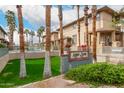 Townhome complex featuring a swimming pool and lush landscaping, offering a resort-style living experience at 702 S Beck Ave, Tempe, AZ 85281