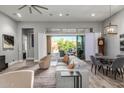 Open-concept living room features a comfortable seating area and sliding glass doors to the patio at 7518 E Vista Bonita Dr, Scottsdale, AZ 85255