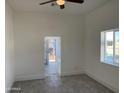 Bright and airy living room with neutral walls, modern flooring, and a view of the front porch through the doorway at 824 S 3Rd Ave, Phoenix, AZ 85003