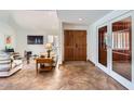 Spacious foyer with beautiful tiled floors and double door closet at 9803 N 100Th Pl, Scottsdale, AZ 85258