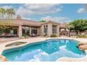 Sparkling pool with spa and desert landscaping, perfect for outdoor enjoyment at 11664 E Del Timbre Dr, Scottsdale, AZ 85259