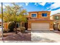 Charming two-story home featuring a well-maintained yard, a spacious driveway, and a classic two-car garage at 12462 N 75Th Ln, Peoria, AZ 85381