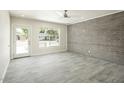 Spacious living room with light gray flooring, a large window and neutral paint at 1432 W 7Th St, Tempe, AZ 85281