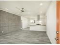 Open-concept living area featuring modern finishes, light gray flooring, and an open kitchen at 1432 W 7Th St, Tempe, AZ 85281