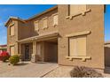 Charming two-story townhome features a desert landscape and covered entryway at 16510 W Tether Trl, Surprise, AZ 85387