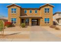 A charming two-story home with a private front entrance and desert landscaping at 16510 W Tether Trl, Surprise, AZ 85387