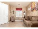 Comfortable living room offers a serene retreat with neutral colors and bright light at 16510 W Tether Trl, Surprise, AZ 85387