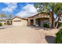 Inviting single-Gathering home with low-maintenance desert landscaping, a tile roof, and a covered entry at 21192 E Stirrup St, Queen Creek, AZ 85142