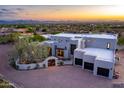 Stunning modern home with a private gated entrance, garage, and mountain views at 22500 N 97Th St, Scottsdale, AZ 85255