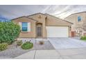 Inviting single-Gathering home displaying desert landscaping, two-car garage, and charming front entryway at 23649 W Watkins St, Buckeye, AZ 85326
