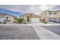 Charming single-story home with a two-car garage, desert landscaping and inviting curb appeal at 23649 W Watkins St, Buckeye, AZ 85326
