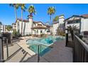 Community pool and spa area with a covered seating area, perfect for relaxation and socializing at 2992 N Miller Rd # 103, Scottsdale, AZ 85251