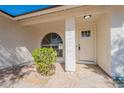 Cozy entrance featuring a decorative window and door plus a stucco column and xeriscaping at 3624 W Whitten St, Chandler, AZ 85226