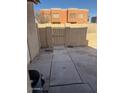 Enclosed patio with concrete pavers and access gate, offering a private outdoor space at 4017 S 45Th St, Phoenix, AZ 85040