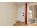 Bright, airy living space with tile flooring, modern window with security bars, and fresh paint at 4730 W Northern Ave # 1158, Glendale, AZ 85301